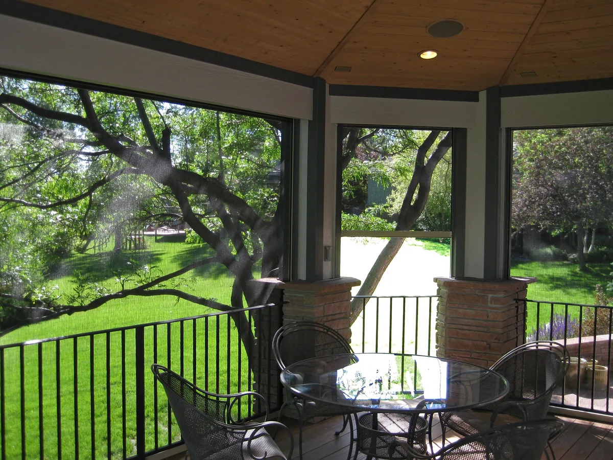 Exterior bug-screen roller shades on a Short Hills porch
