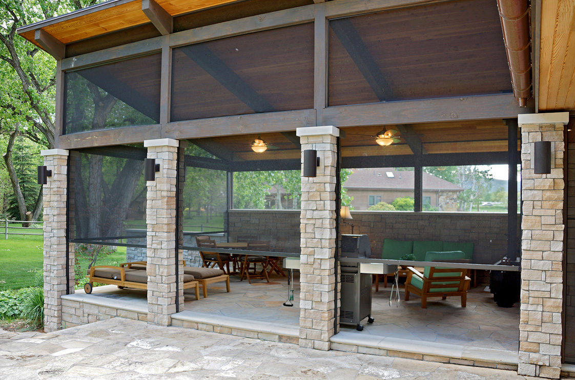 Zip-track outdoor shade system on a covered porch