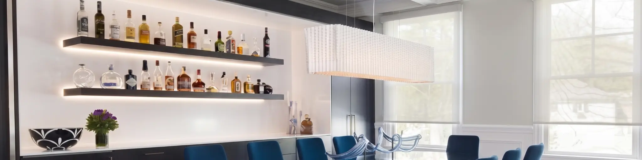 Luxury dining room with motorized roller shades